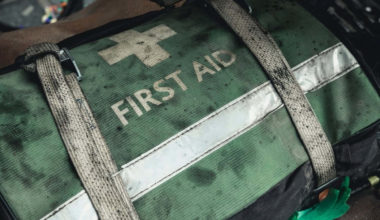 Prepper first aid kit tied down in a vehicle