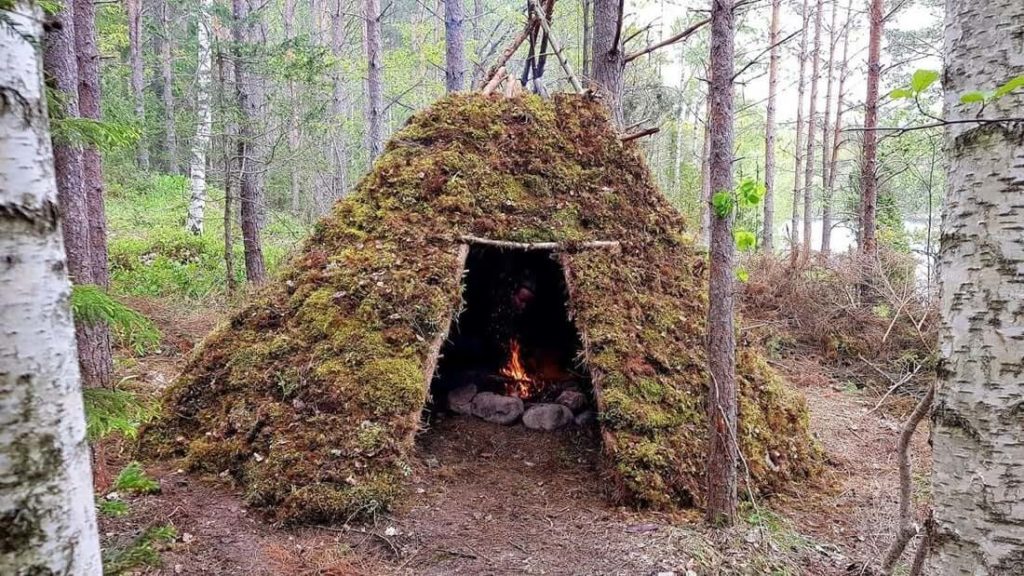 A teepee long term survival shelter setup