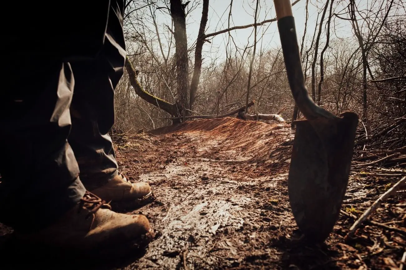 Man using one of the best survival shovels